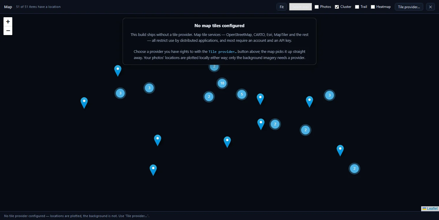 The map overlay with clustered pins on a blank background and the No map tiles configured box